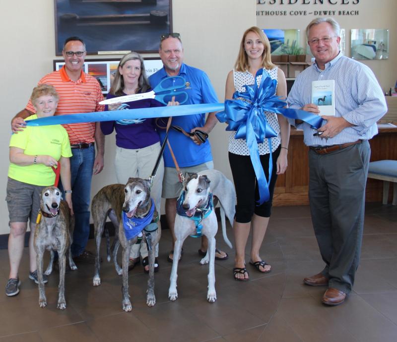 The Rehoboth-Dewey Beach Chamber of Commerce celebrated member Greyhounds Reach the Beach with a ribbon cutting Oct. 4 with (l-r) Volunteer Coordinator Gail Rys, Sen. Ernie Lopez, Public Relations Coordinator Sarah Dougherty, Dewey Commissioner Paul Bauer, Rehoboth-Dewey Chamber representative Lisa Newnom and Dewey Mayor T.J. Redefer. SUBMITTED PHOTO